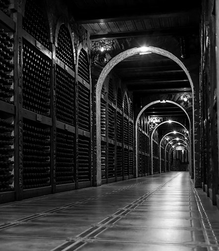 A lots of wines are placed in the wine cave.