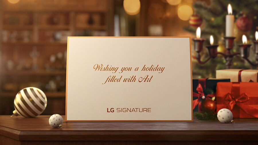 A white hodiay card from the LG SIGNATURE is placed on the desk.