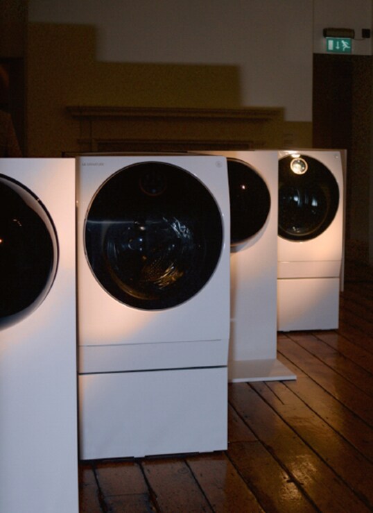 LG SIGNATURE Washing Machines are placed on the wood floor