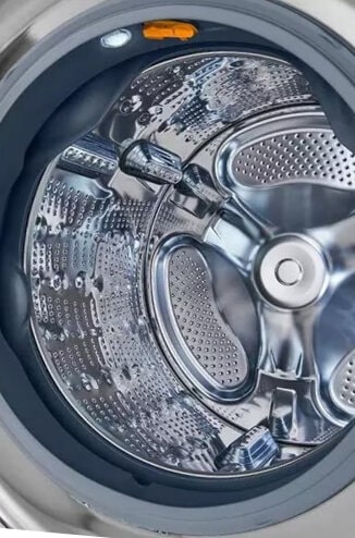 Close-up of an LG Studio washing machine drum with a metallic shine.