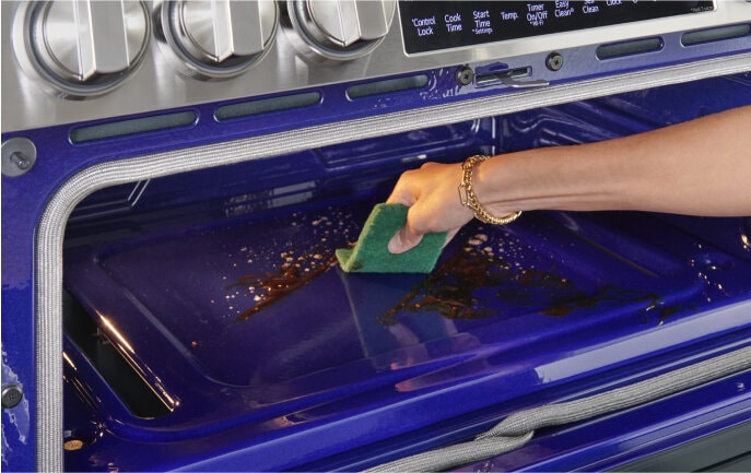 Cleaning the EasyClean interior of an LG oven, showing how simple maintenance can be.