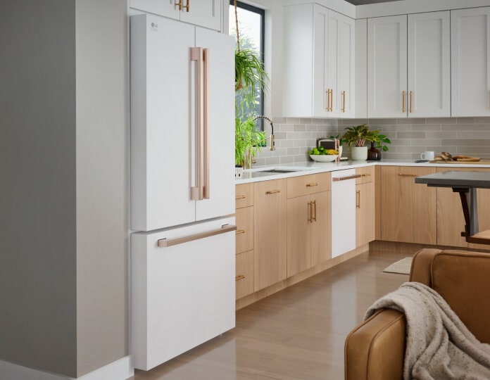 LG Studio Counter-Depth Max refrigerator in a bright kitchen with wooden accents.