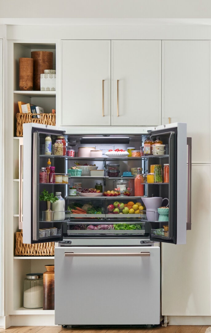 Close-up of built-in refrigerator fitting seamlessly with kitchen cabinetry.