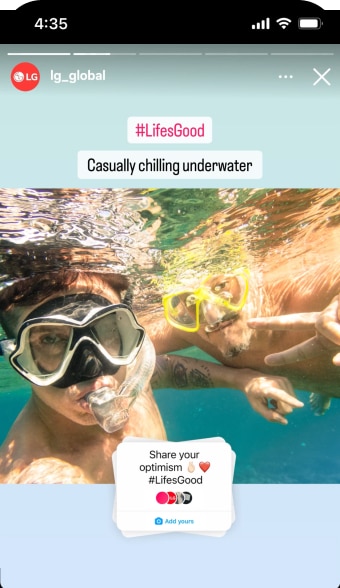 Two people with snorkeling gear underwater, casually chilling.