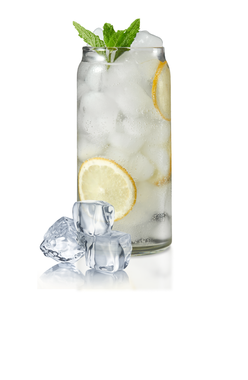 Clear carbonated drink in a clear glass with standard ice cubes, lemon slices and mint.