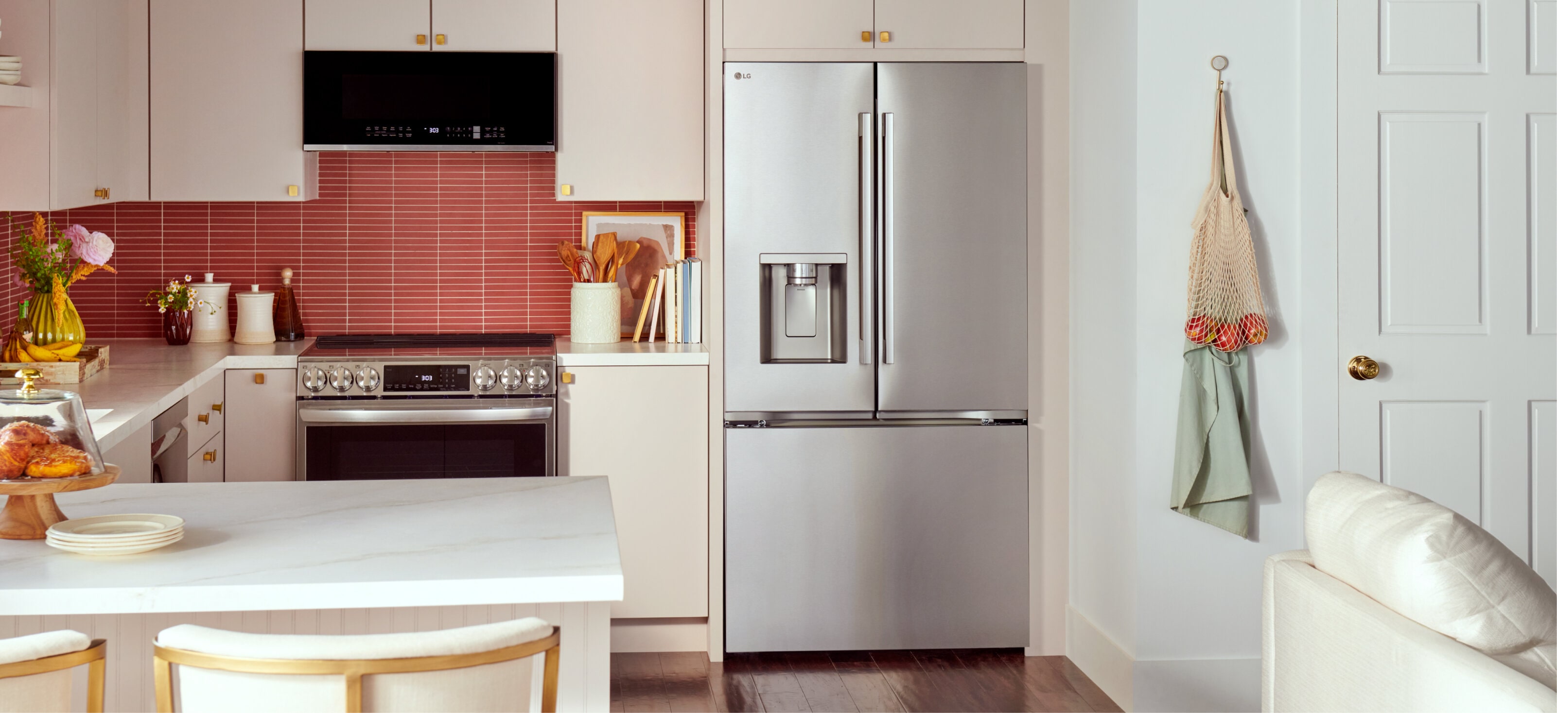 Front of stainless steel Counter-Depth MAX Refrigerator with Zero Clearance set in a modern white kitchen.