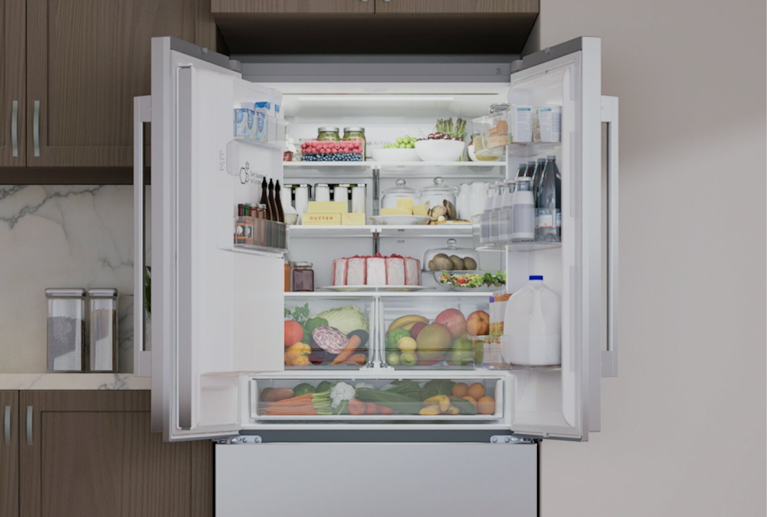 Refrigerator in a kitchen with doors open showing the interior filled with food.