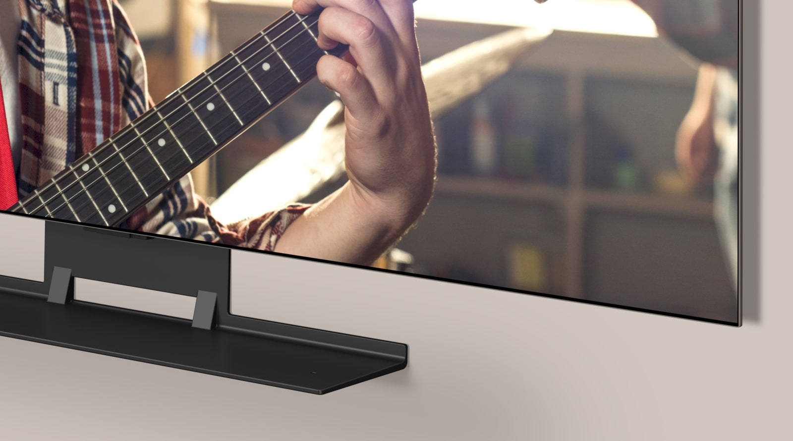 LG OLED TV and Synergy bracket are shown within an angled view of the bottom. The LG Soundbar slots into the Synergy Bracket.